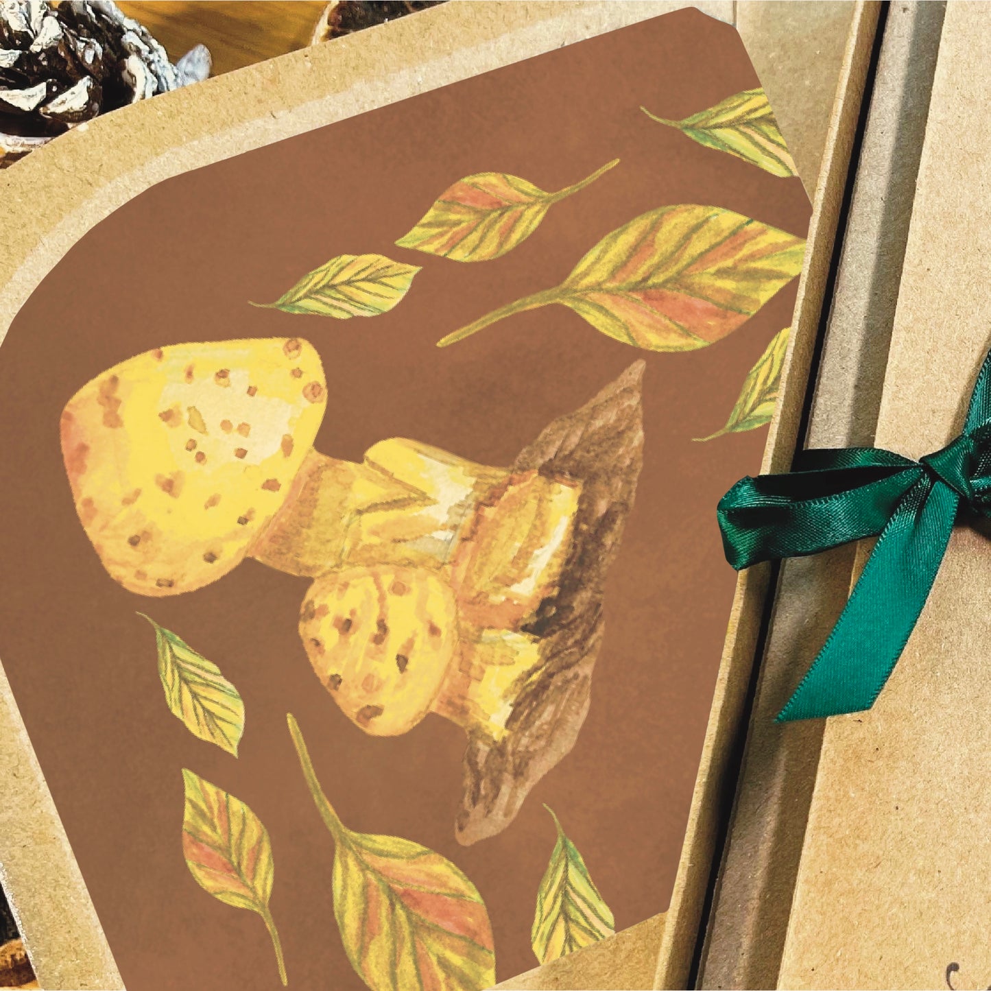 Close up of mushroom decorated inlay of a brown envelope