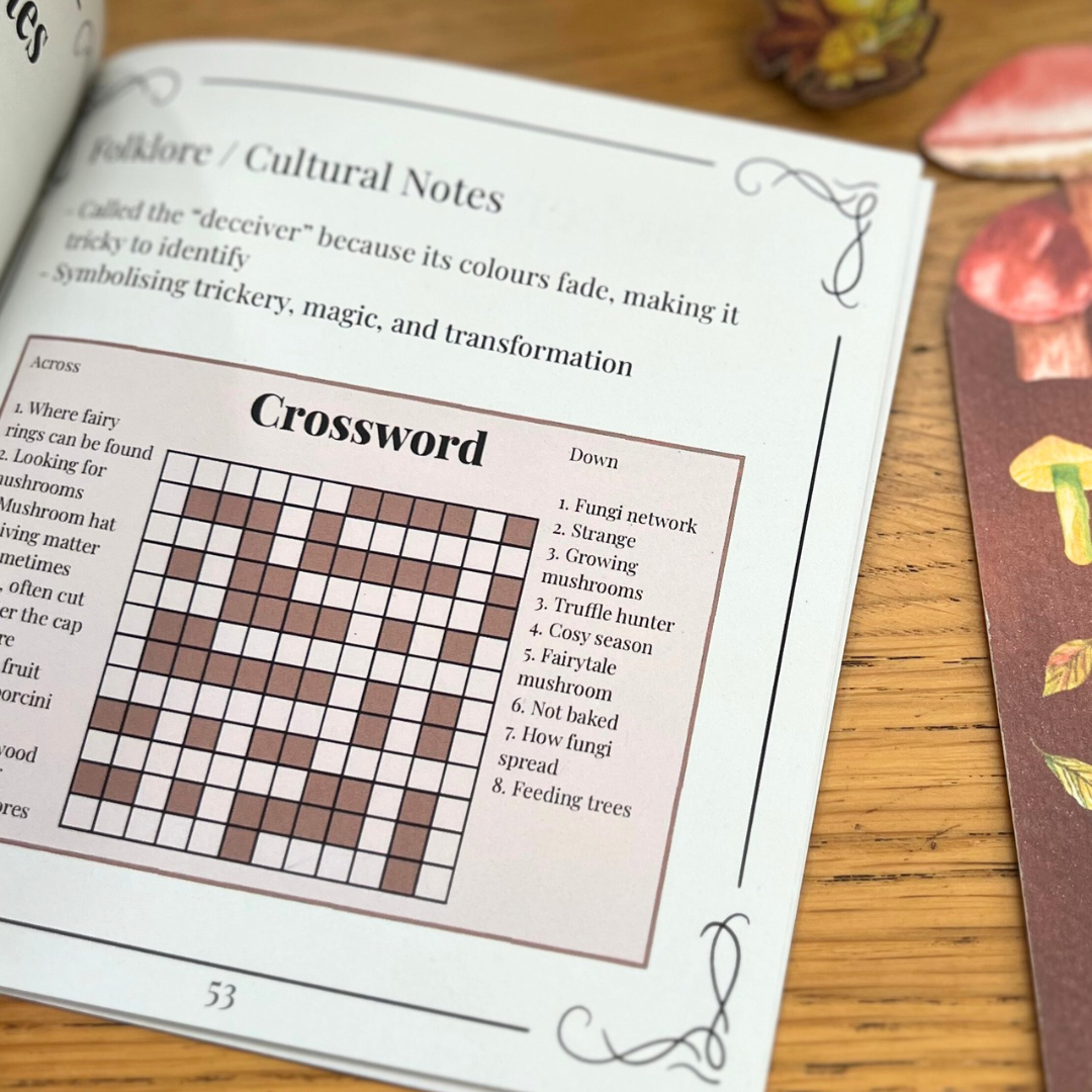 The Pocket Forager interior page showing folklore notes and a crossword puzzle inspired by mushroom terminology and woodland magic.