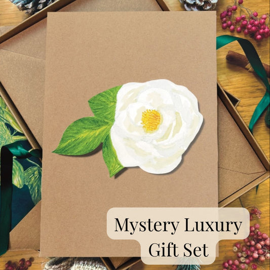 Brown Kraft greetings card with a white rose flower design on a wooden surface with decorative elements.